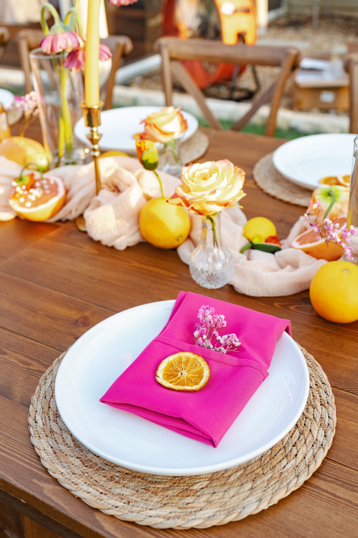 Floral arch backdrop and tablescape at golden hour