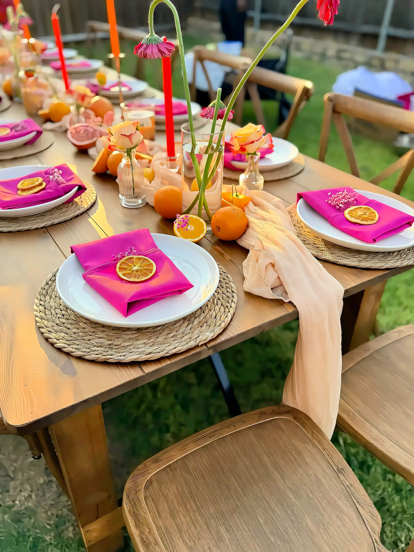 Styled tablescape detail with roses, candles and citrus