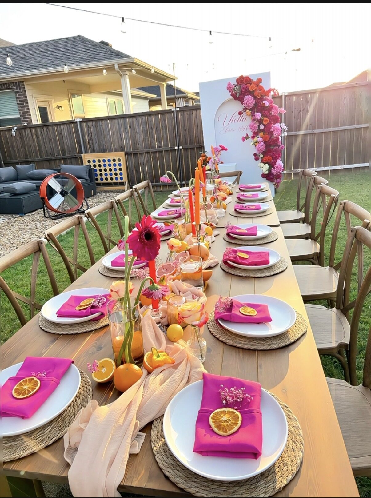 Wide tablescape with floral arch, golden hour